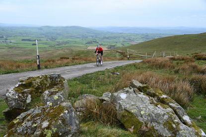 A lone road cyclist on a climb in North West England