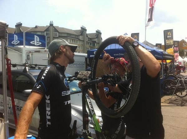 Jeremy Horgan-Kobelski and Heather Irmiger check out a tire after pre-riding the course