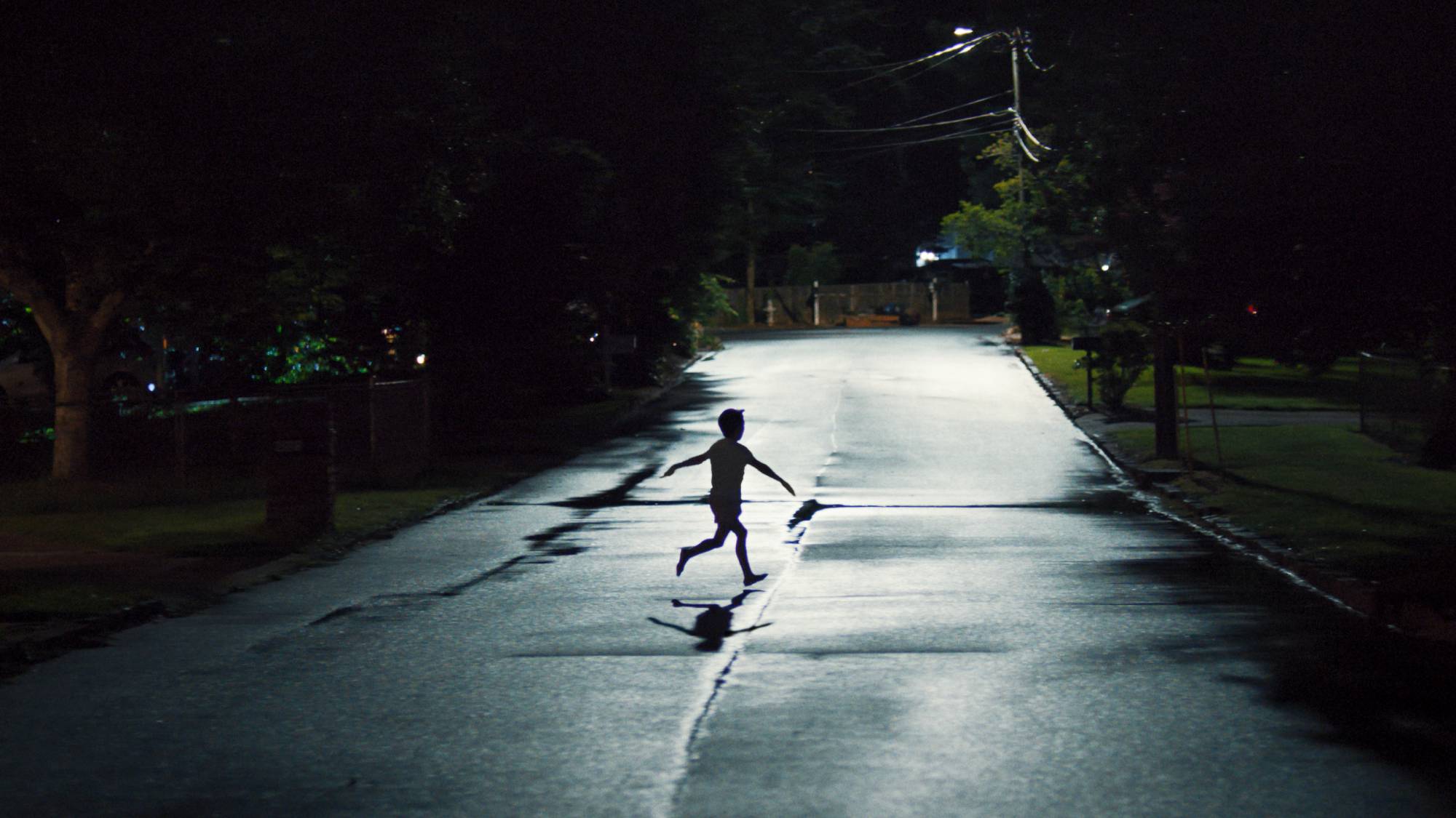 A scene of a child running on the street in "Weapons" movie (2025)