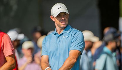 McIlroy holds a driver 