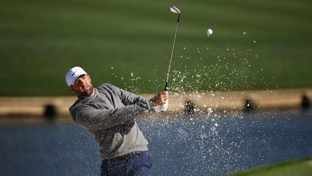 Scottie Scheffler of the United States plays a shot from a bunker prior to The Players Championship at TPC Sawgrass