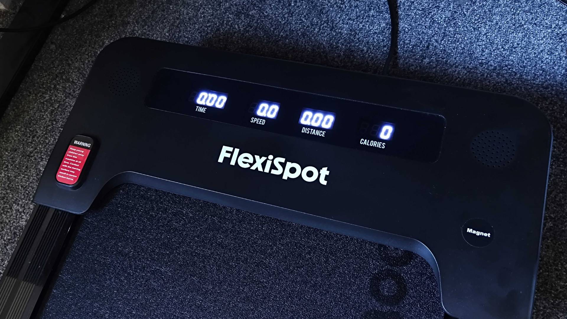 Flexispot Treadmill dash with illuminated digits for time, speed, distance, and calories.