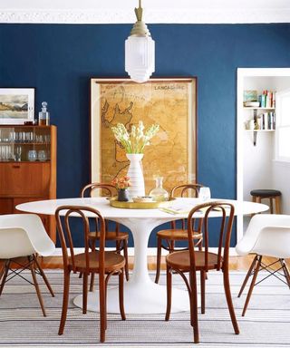 Farrow and Ball traditional dining room idea with Stiffkey blue and wooden dining set