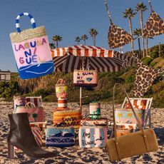 A press image of The Ritz-Carlton x Kilometre Paris handbag collaboration shot on Laguna Beach. 