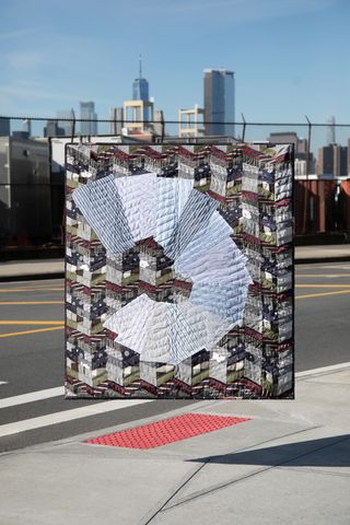 APC quilt against New York backdrop