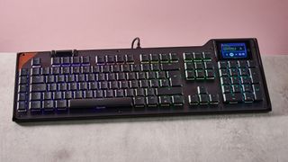 Turtle Beach Command Series KB5 on desk with pink wall in background