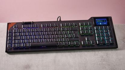 Turtle Beach Command Series KB5 on desk with pink wall in background