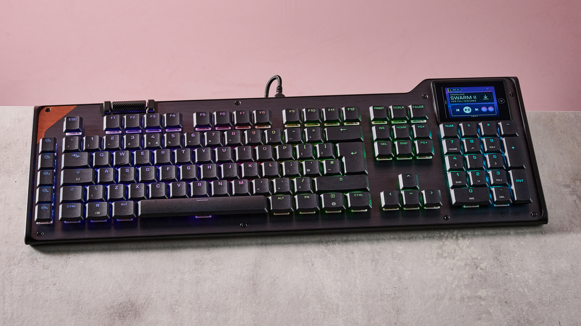 Turtle Beach Command Series KB5 on desk with pink wall in background
