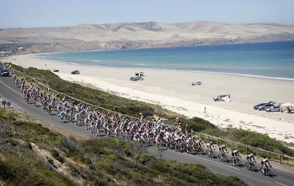 The peloton pass the beach