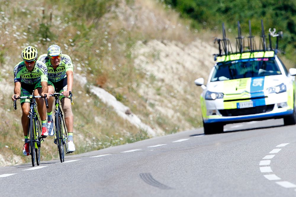 Stefano Feltrin paces Tinkoff-Saxo team boss Oleg Tinkov as they ride in France on Monday.