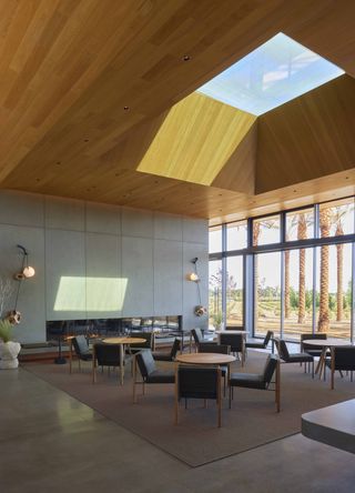 Caymus-Suisun Winery interior with skylight set in wood ceiling