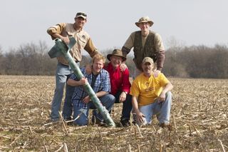 Rednecks pose with their moonshine-powered rocket post-launch. (L to R) Michael Taylor, Travis Taylor, Charles "Daddy" Taylor, Pete Erbach (standing), Rog Jones.