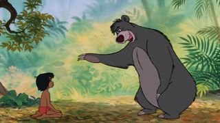 Baloo dances with Mowgli in The Jungle Book