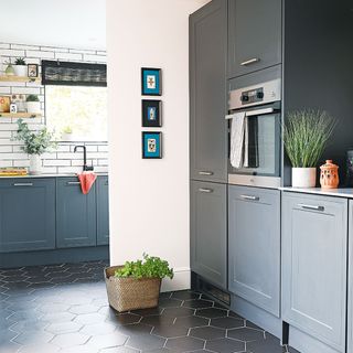 black kitchen with white tiles