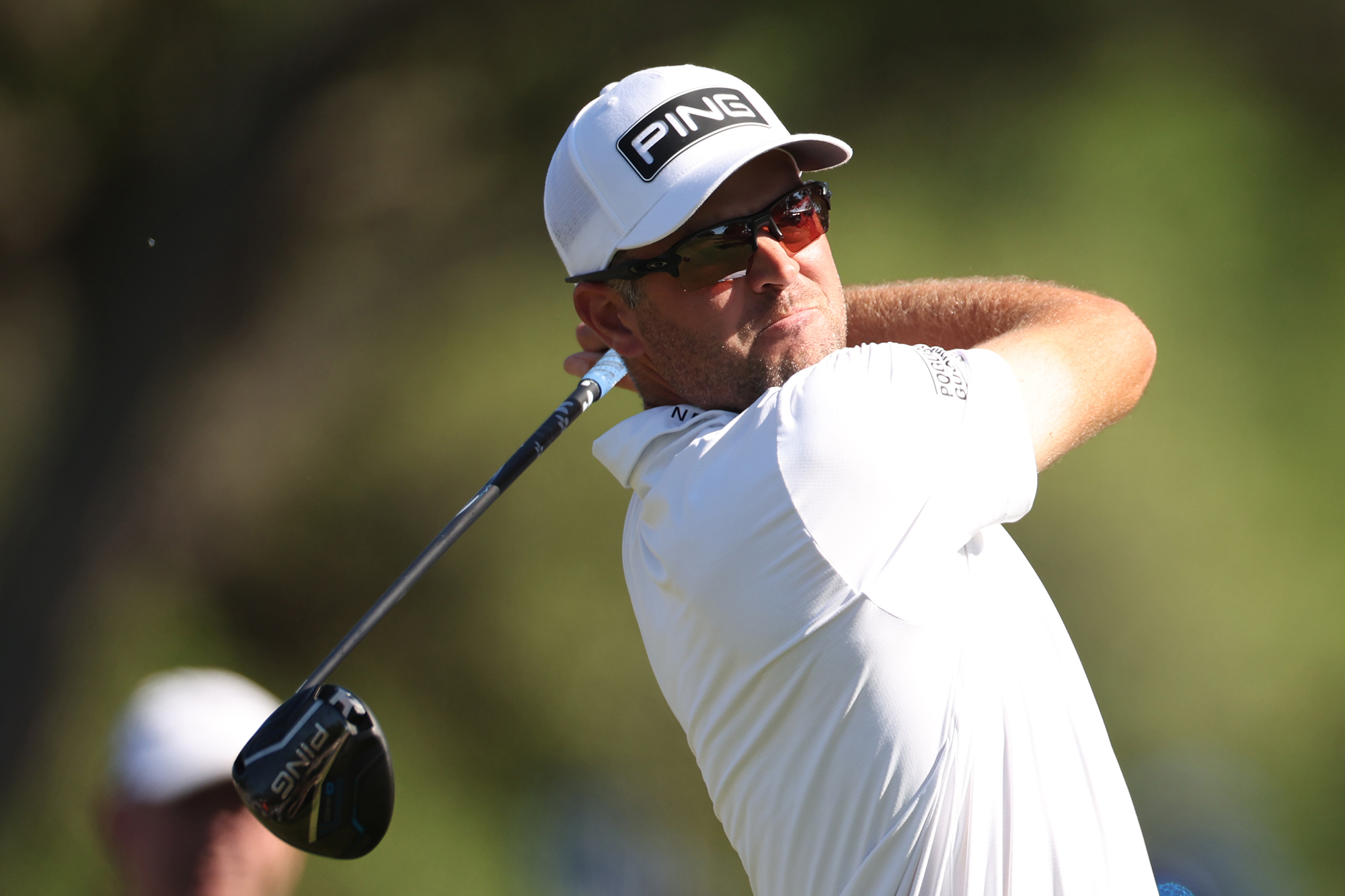 Corey Conners in the finish positon with driver