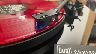Dual CS 618Q turntable showing cartridge playing pink vinyl