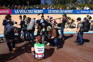 ROUBAIX FRANCE APRIL 16 Elisa Longo Borghini of Italy and Team Trek Segafredo celebrates winning surrounded by photographers in the Roubaix Velodrome Vlodrome Andr Ptrieux during the 2nd ParisRoubaix 2022 Womens Elite a 1247km one day race from Denain to Roubaix ParisRoubaixFemmes ParisRoubaix on April 16 2022 in Roubaix France Photo by Tim de WaeleGetty Images