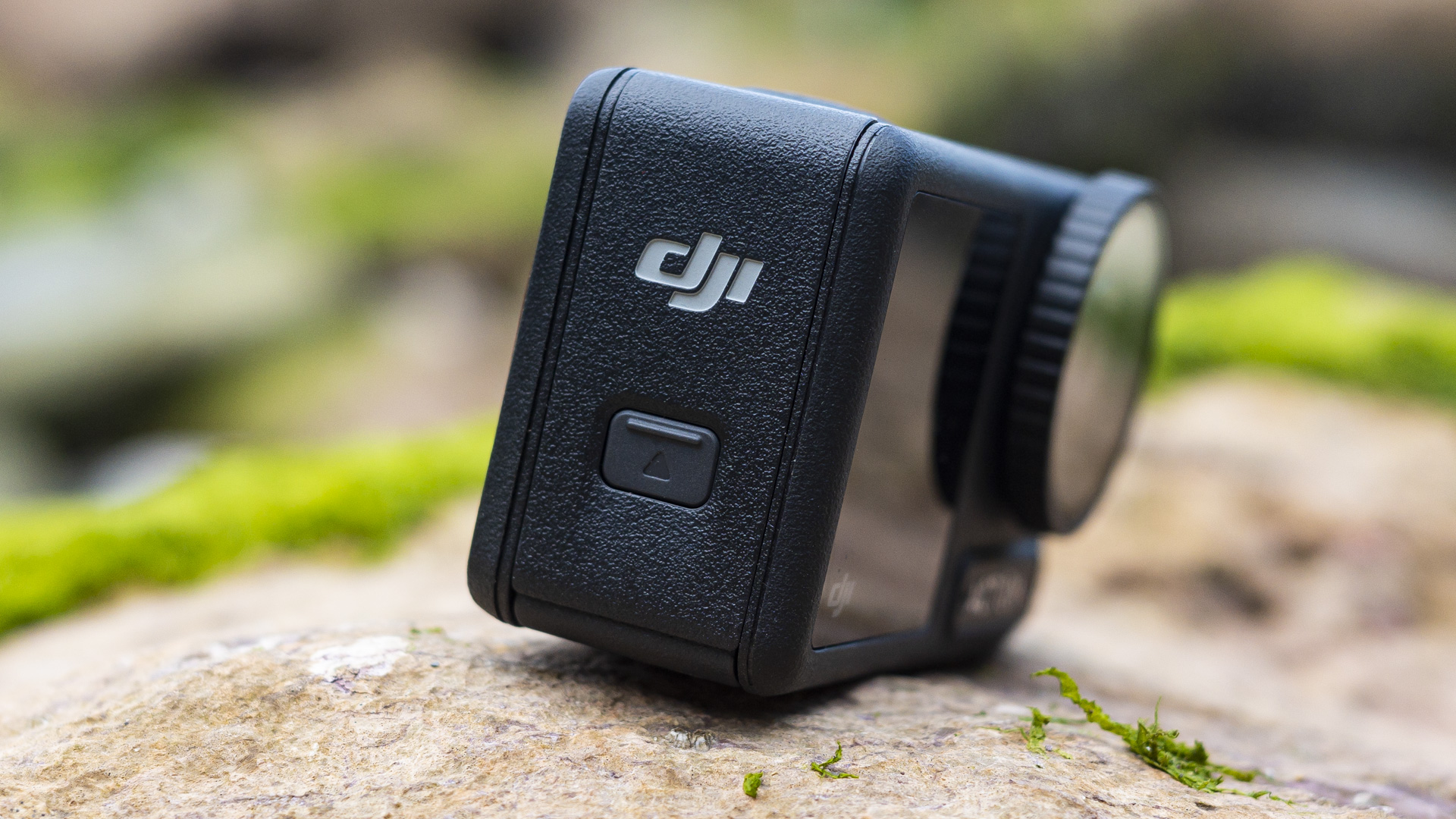 DJI Osmo Action 4 camera side view with battery and card door
