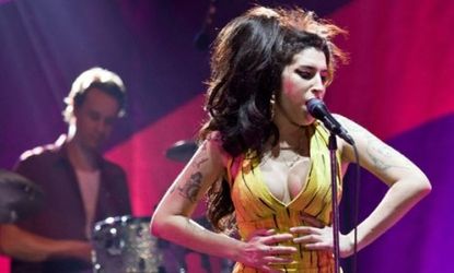 Amy Winehouse during a January 2011 concert in Brazil: The singer had been working on a third album before she died, and now critics debate whether it should be released.