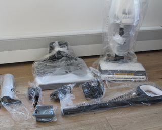 Tineco Floor One S7 steam wet-dry vacuum and accessories wrapped in plastic packaging