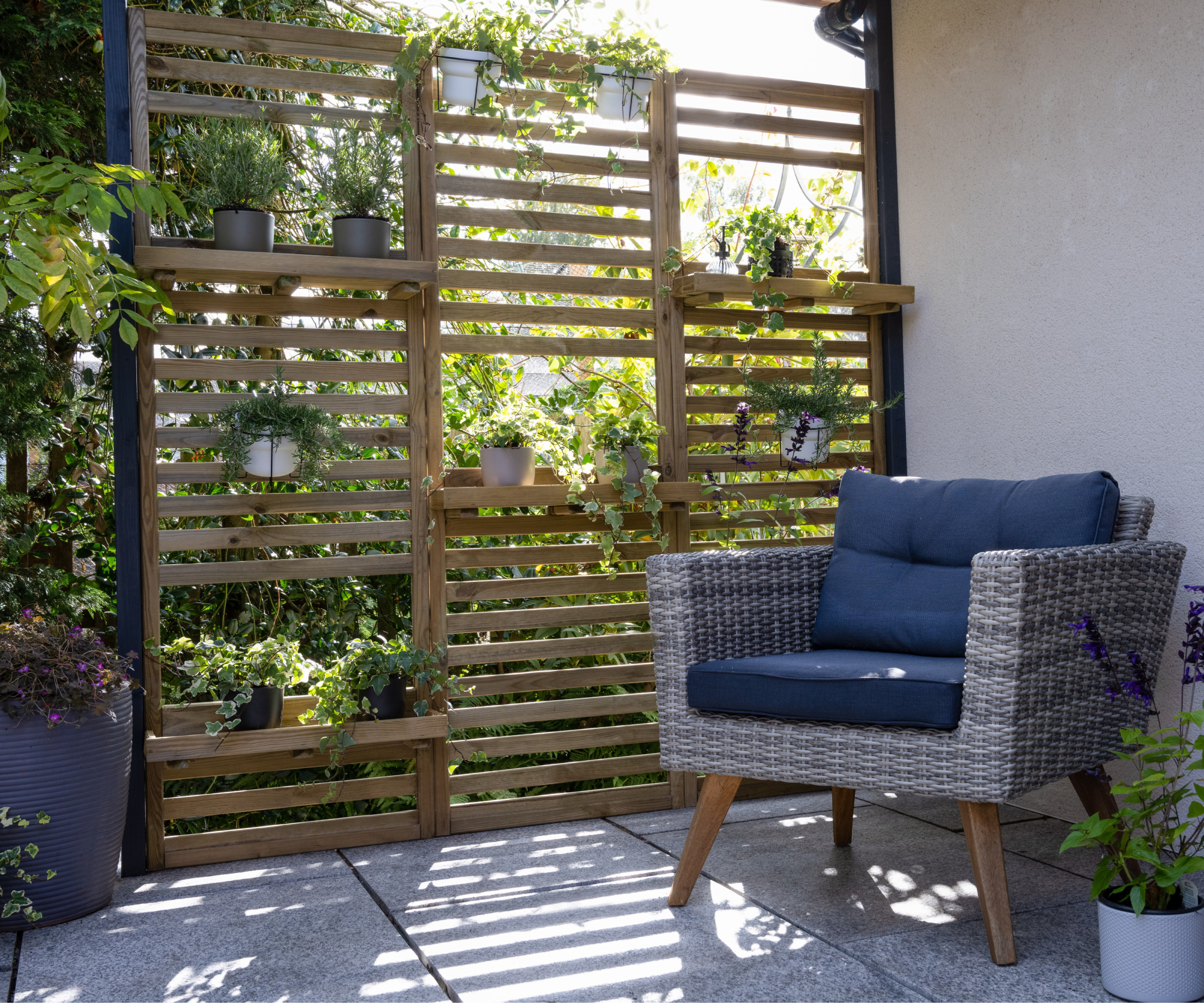 slatted wall fence with hanging plants