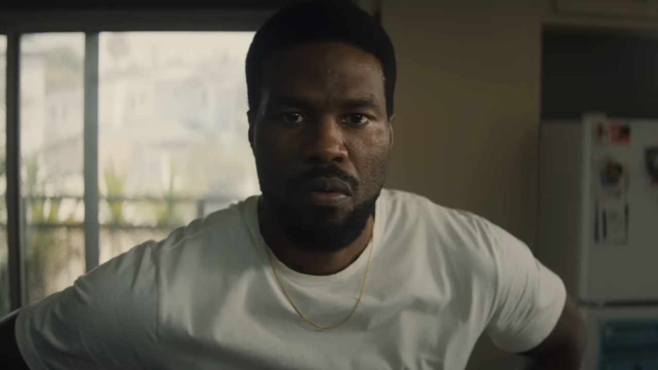 Simon Williams (Yahya Abdul-Mateen II) watches TV on Wonder Man.