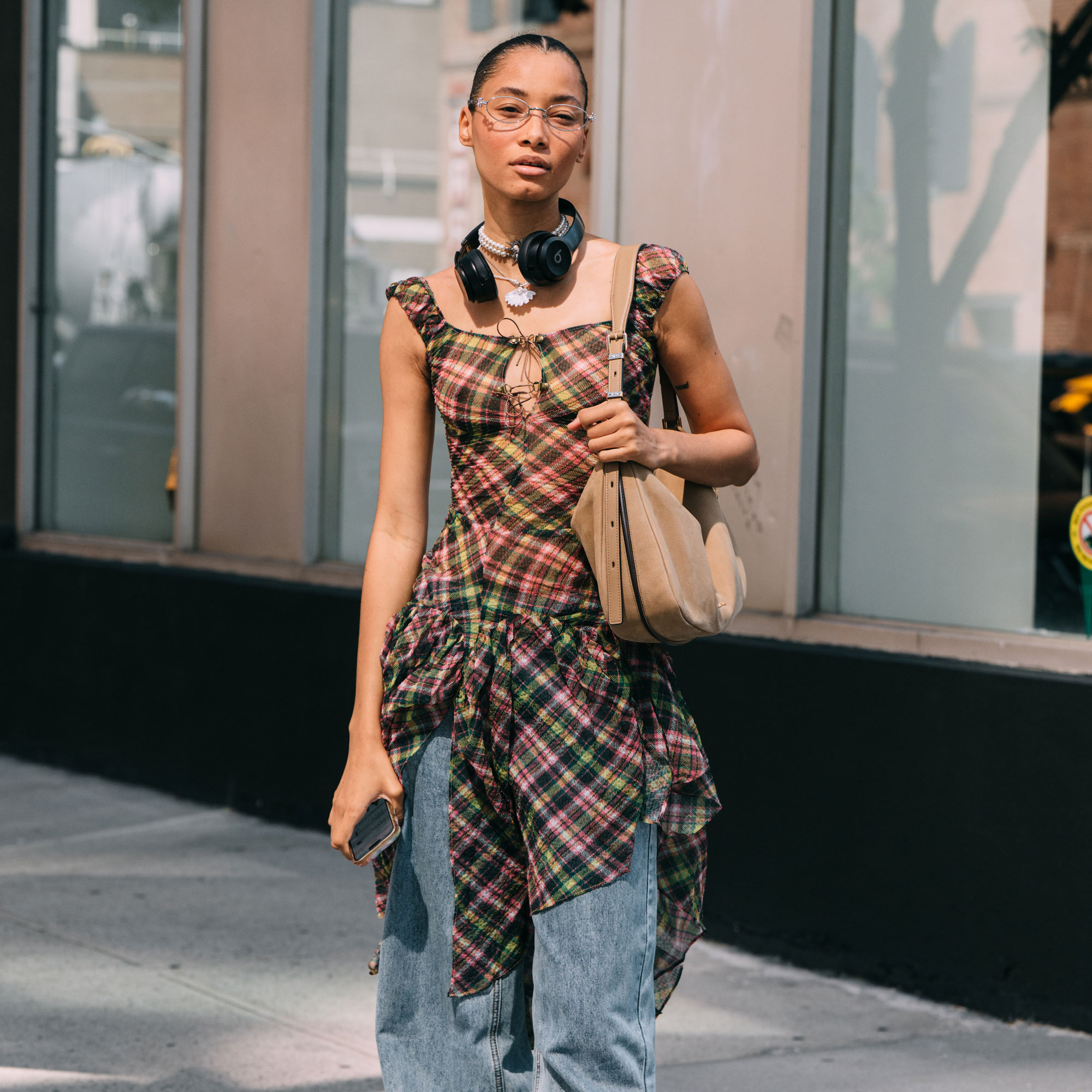 a woman wears ballet flats with jeans