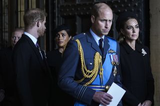Prince William, Prince of Wales with Catherine, Princess of Wales and Prince Harry with Meghan, Duchess of Sussex leave after escorting the coffin of Queen Elizabeth II to Westminster Hall from Buckingham Palace for her lying in state, on September 14, 2022 in London, United Kingdom.