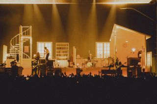 yellow light on The 1975 stage Design in london, looking like a house