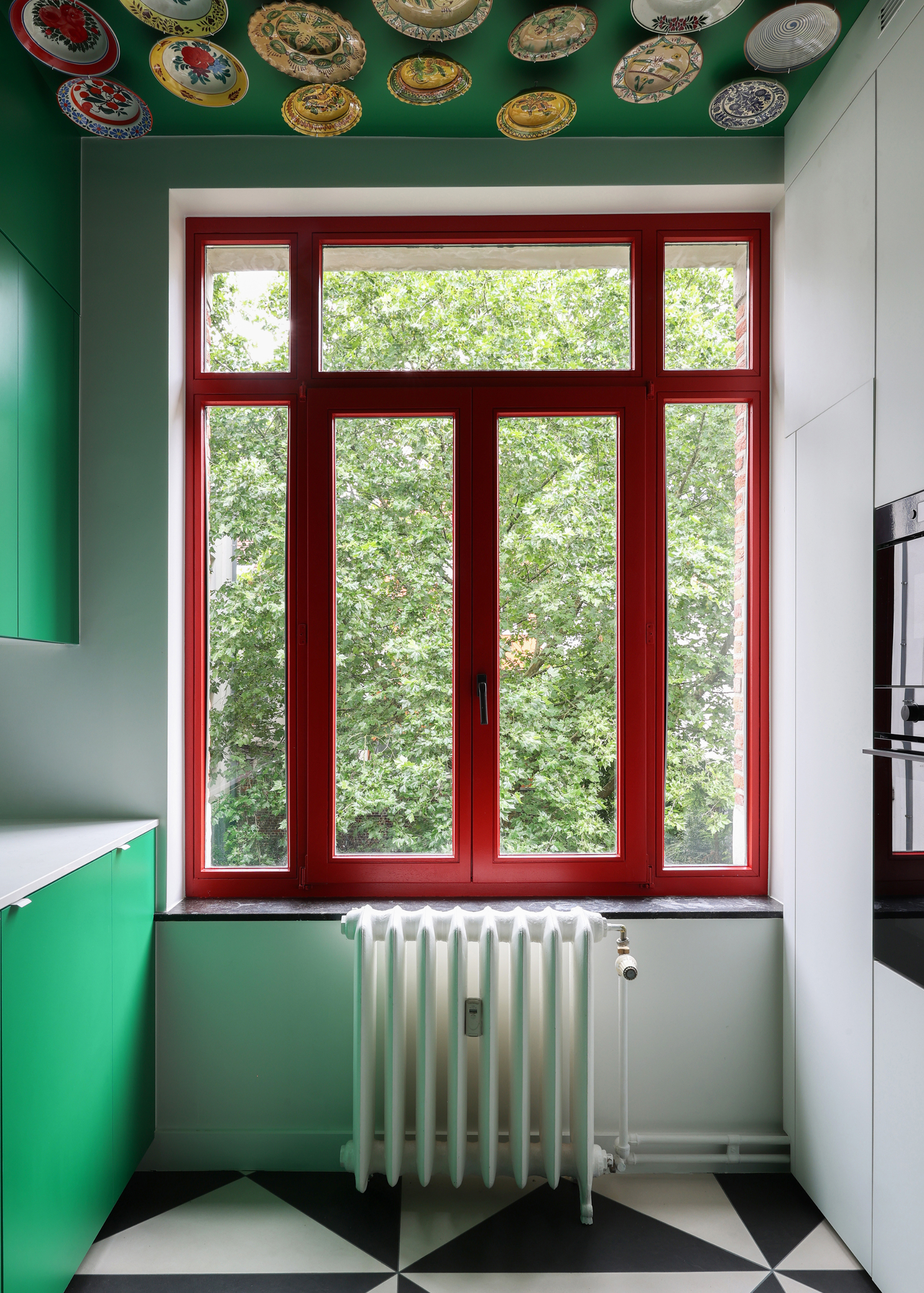 small kitchen with a red window frame