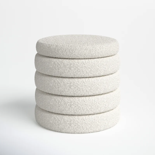 round boucle ottoman with layered disk detail