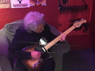Marty Stuart plays one of Gene Parsons' new custom StringBender guitars backstage at the Mystic Theatre in Petaluma, California (Photo: Lee Rider)