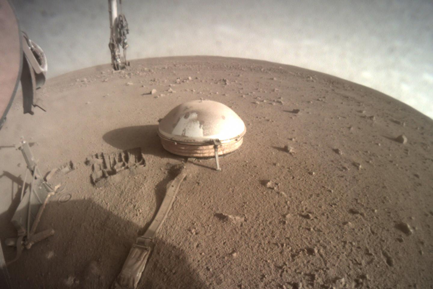 An image of part of NASA's InSight lander. InSight is studying marsquakes on the Red Planet, which could hint at core activity.