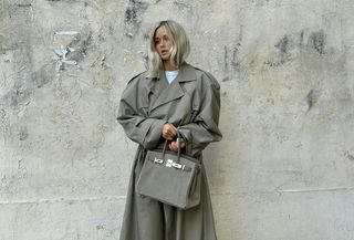 influencer @josefinehj wearing a grey trench coat and grey suede Birkin 25 handbag