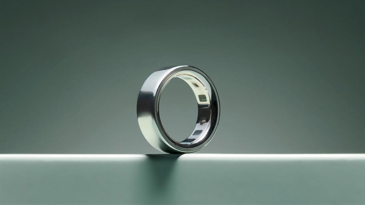The silver Oura Ring 4 on turquoise surface