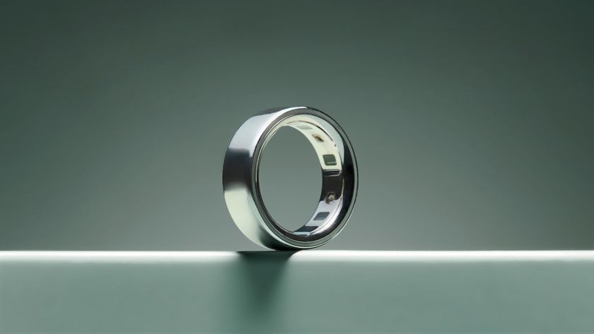 The silver Oura Ring 4 on turquoise surface