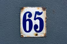 The number 65 on a metal plate