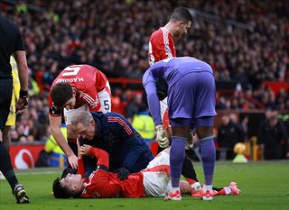 MANCHESTER, ENGLAND - FEBRUARY 2: Lisandro Martinez of Manchester United is treated for injury during the Premier League match between Manchester United FC and Crystal Palace FC at Old Trafford on February 2, 2025 in Manchester, England. (Photo by Ed Sykes/Sportsphoto/Allstar via Getty Images)