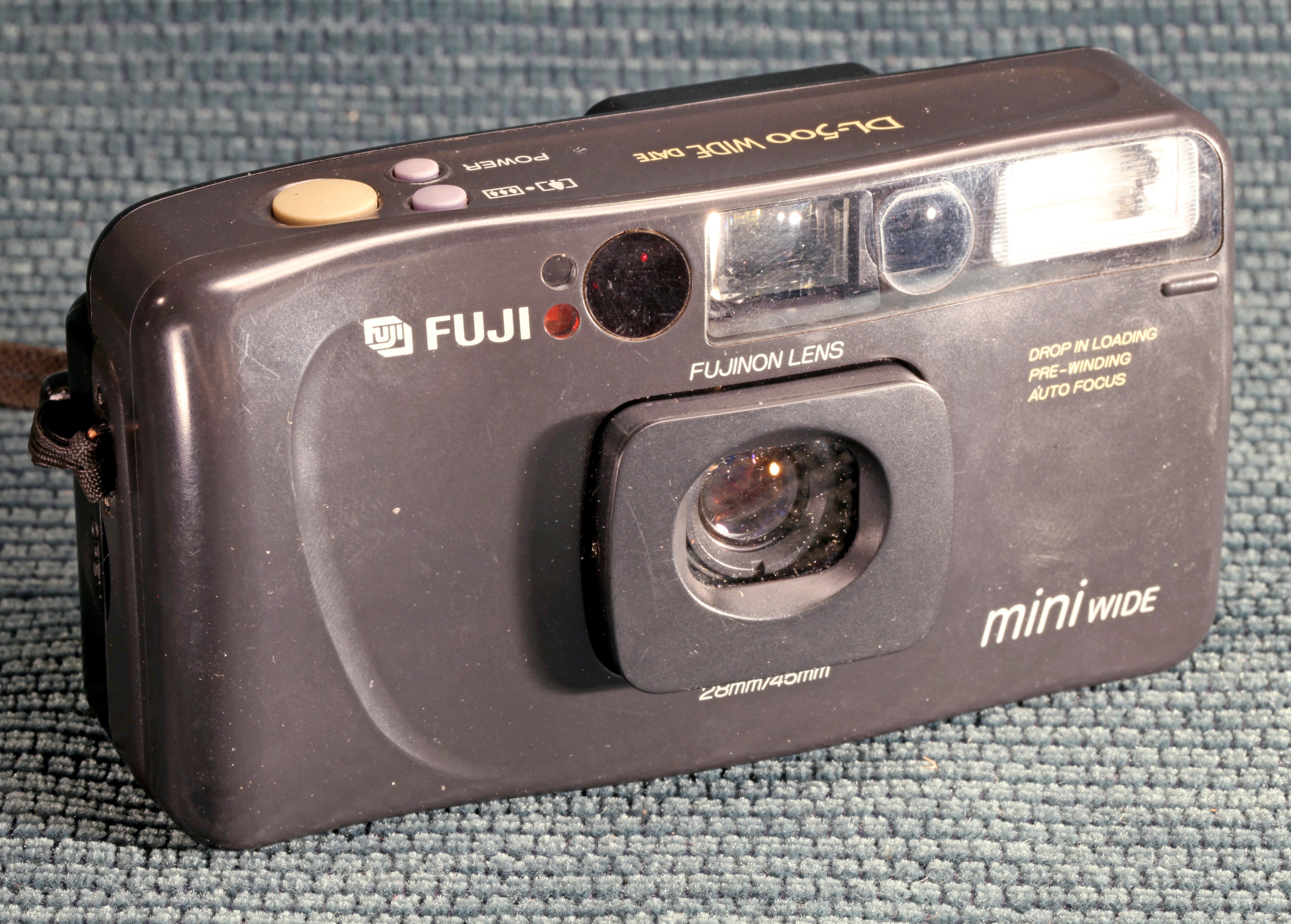 The Fuji DL-500 Travel Mini on a blue background