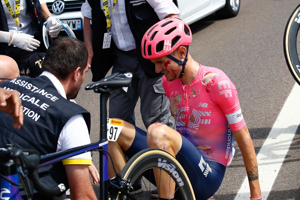 Tejay van Garderen sits on the ground after crashing during stage 7 at the Tour de France