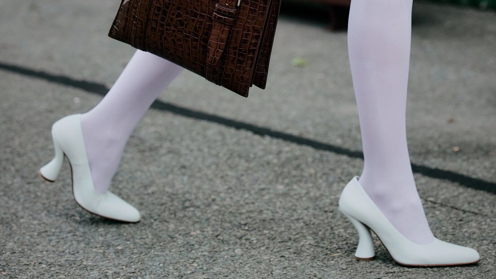 Person in Copenhagen wearing white stockings and white pumps.