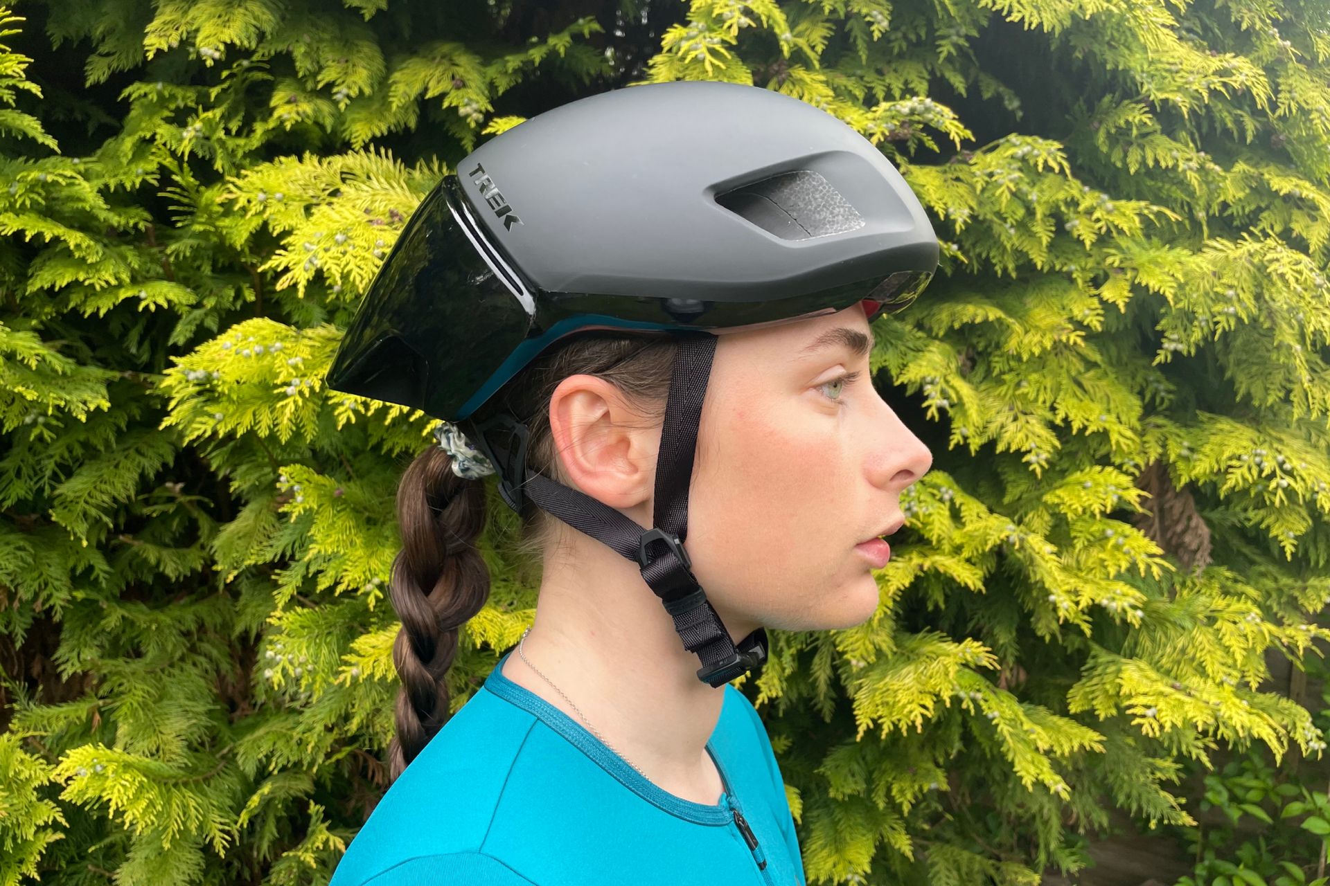 Female cyclist wearing the Trek Ballista MIPS road bike helmet
