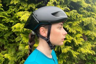 Female cyclist wearing the Trek Ballista MIPS road bike helmet