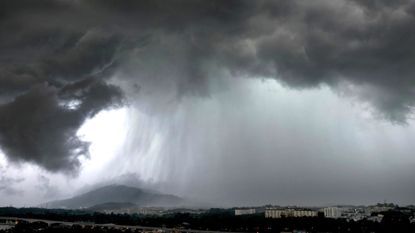 A stock image of a storm with heavy rain.