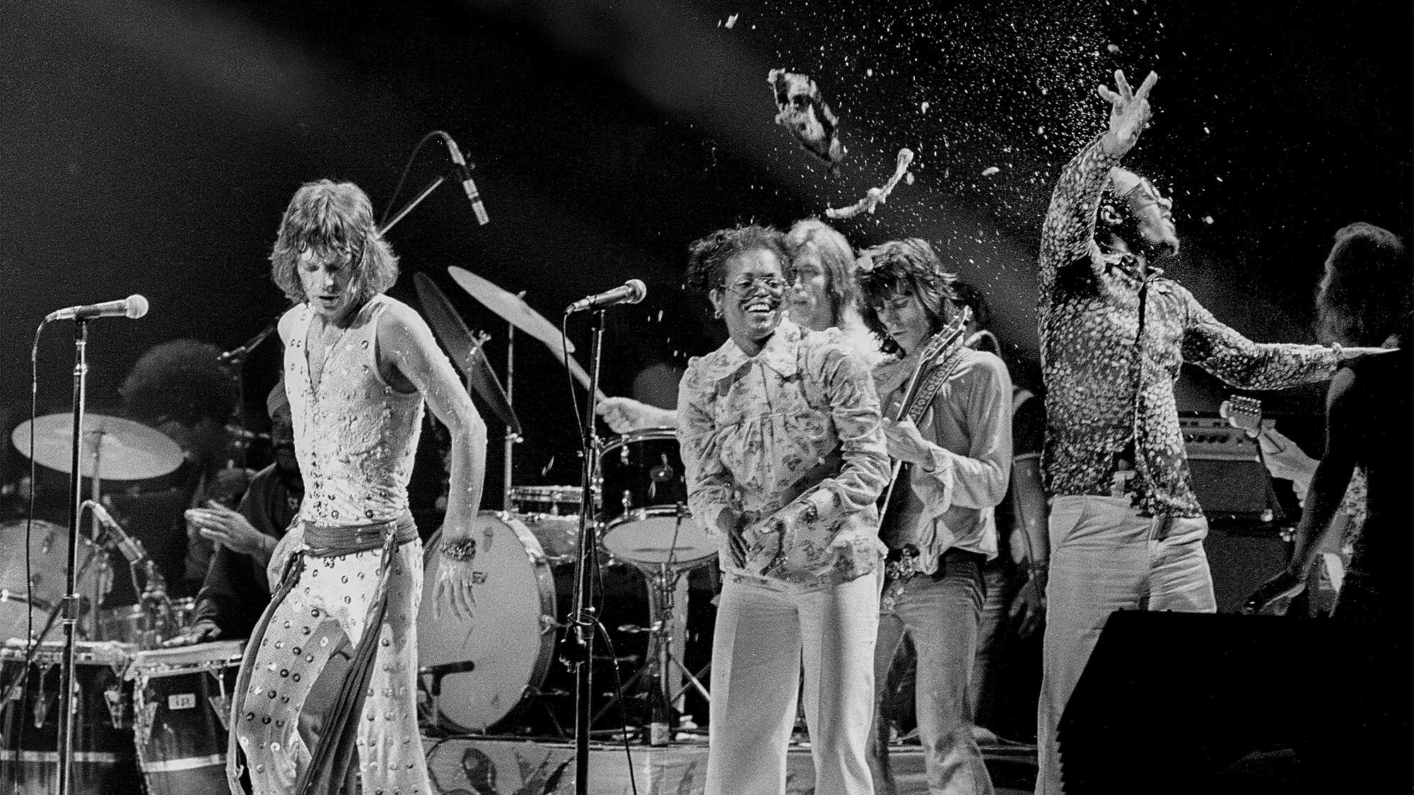 Rolling Stones Mick Jagger and Stevie Wonder are nearly creamed by cream pie