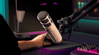 Rode Podcaster microphone on a mount in a studio