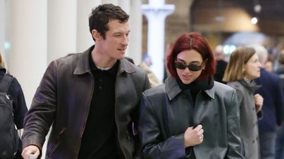 Callum Turner and Dua Lipa travel together with luggage in London
