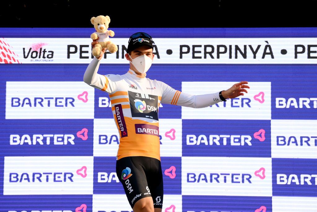 PERPIGNAN FRANCE MARCH 22 Jonas Iversby Hvideberg of Norway and Team DSM celebrates winning the best yellow young jersey in the podium ceremony after the 101st Volta Ciclista a Catalunya 2022 Stage 2 a 2024km stage from LEscala to Perpignan VoltaCatalunya101 WorldTour on March 22 2022 in Perpignan France Photo by David RamosGetty Images