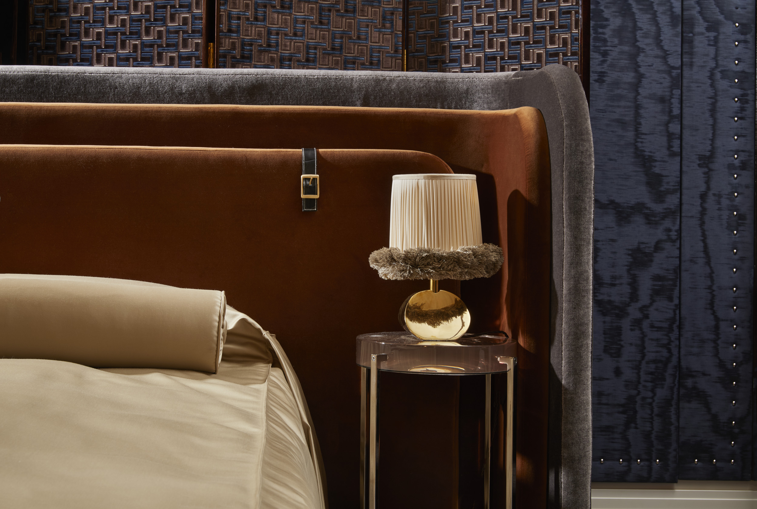 A series of interior shots of beautifully furnished spaces with a blue, white, and gold palette and plenty of textural elements like artworks, handcrafted accessories, and pendant lighting.