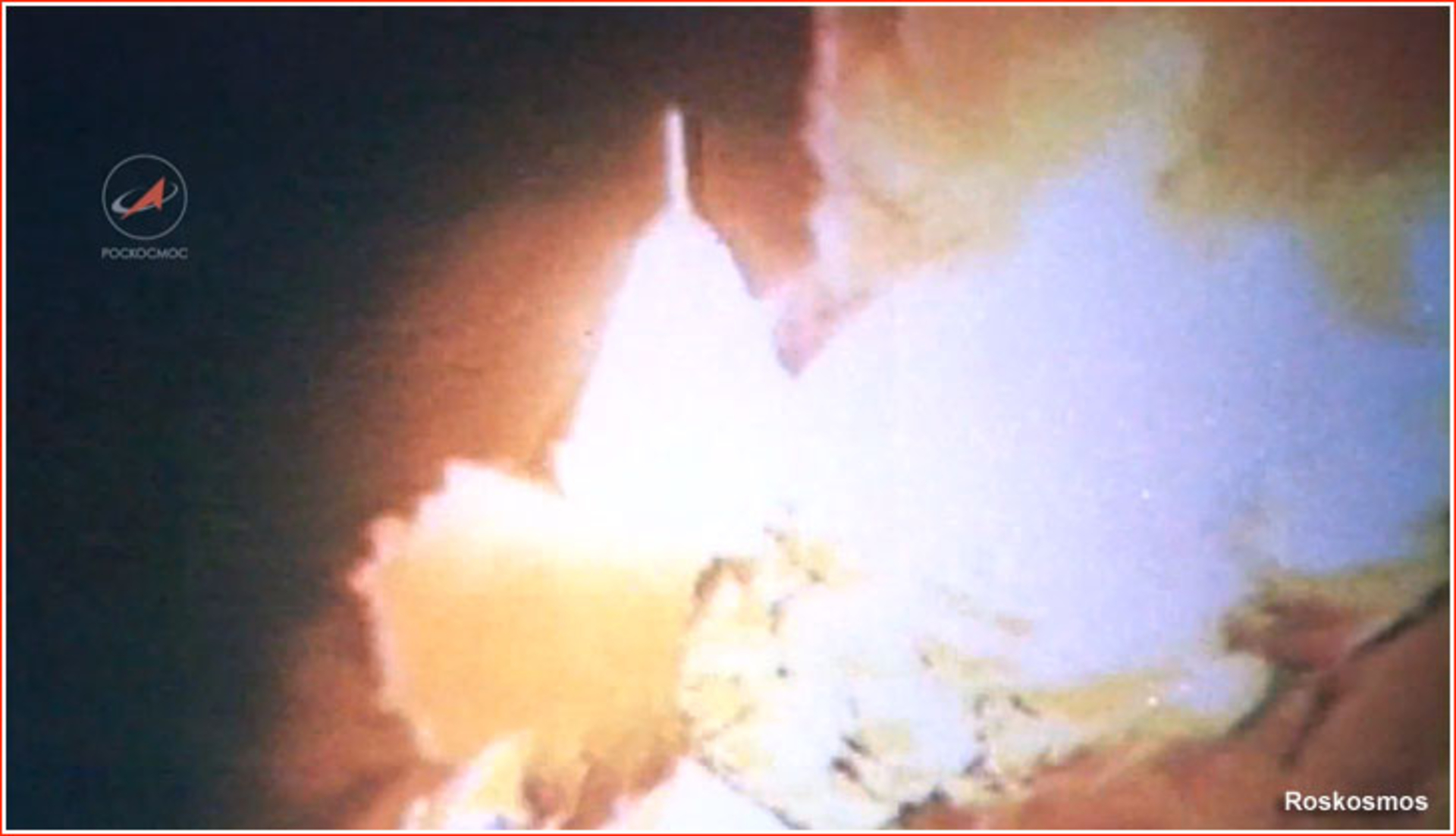 A rocket is engulfed in flames on the launch pad